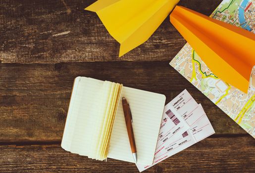 Travel. Paper airplanes on the table