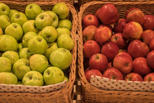 Counter with ripe apples in supermarket 
