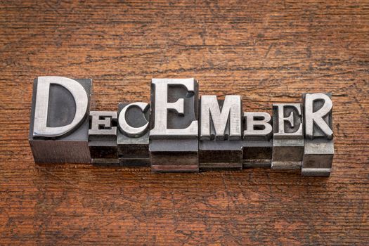 December  word in mixed vintage metal type printing blocks over grunge wood