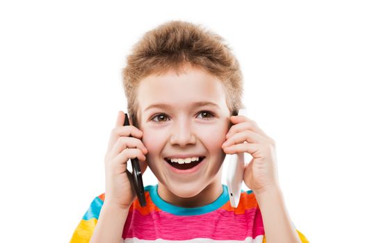 Beauty smiling child boy hand holding two mobile phones or talking pair of smartphones white isolated