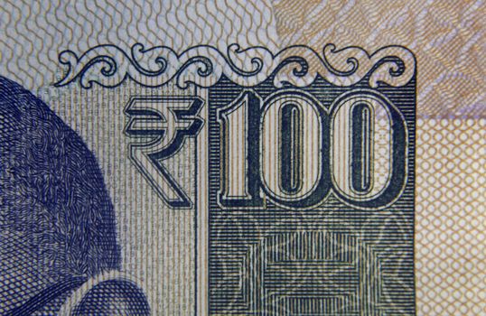 Rupee Symbol on Hundred rupee banknote