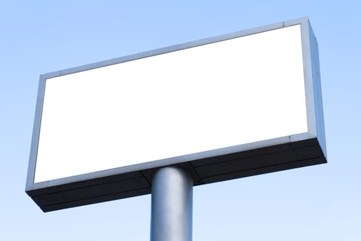 Big blank billboard with clear blue sky.