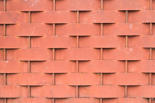Red metallic brick pattern textured background.