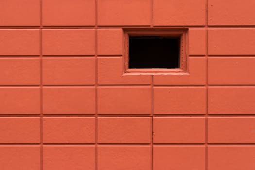 Red brick pattern textured background and a window hole.