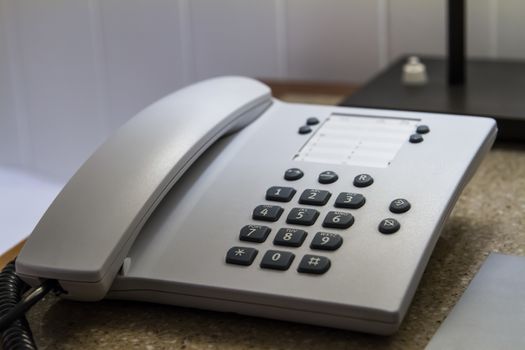 Telephone for customer service in hotel room.
