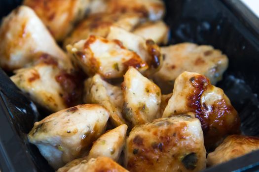 Fried chicken wings with sauce.
