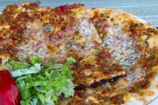 close up view of lahmacun with green salad.