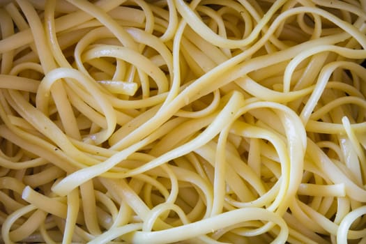 Close up view of pile of cooked spaghetti.