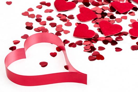 small red hearts confetti with big heart isolated on white background