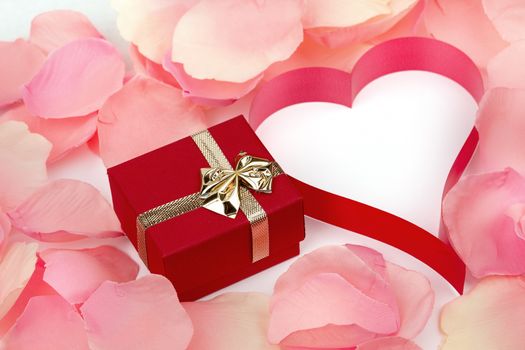 rose petals, heart and valentine present box background with space for text