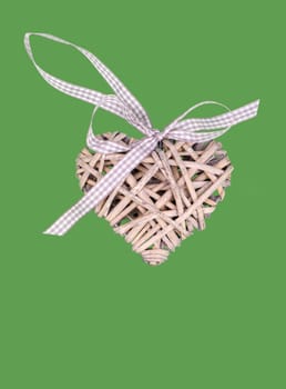 valentine's wooden hearts isolated on green background, valentine postcard with space for text