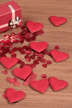 small red hearts confetti and present box full of hearts, valentine love concept