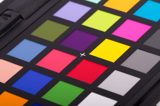 Close up view of color checker equipment of professional photographer for adjust and balance photograph.