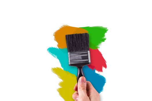 Hand painting on white wall with colorful variations.