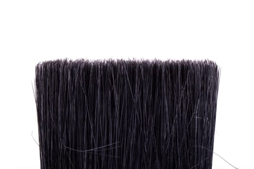 Detail view of paint brush, isolated on white background.