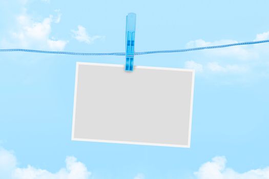 Blank white empty paper frame for your message on cloudy background.