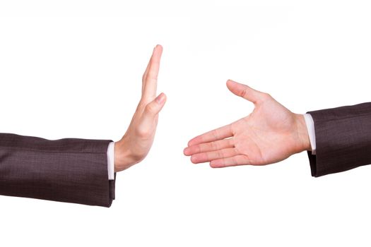 Businessman hands, one of reaching for handshake, the other gesturing stop sign, isolated on white background.