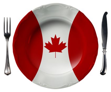 Concept of Canadian cuisine with empty plate colored with the colors of Canadian flag and silver cutlery isolated on white background