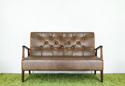 Vintage leather sofa with brown and made of solid wood.