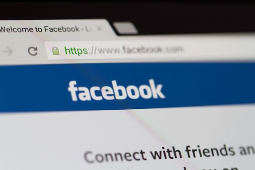 ISTANBUL, TURKEY - MARCH 16, 2013: Photo of Facebook.com home page and logo on tablet. Facebook is the largest social media network and owned by Facebook, Inc.