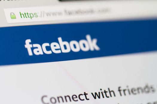 ISTANBUL, TURKEY - MARCH 16, 2013: Photo of Facebook.com home page on tablet. Facebook is the largest social media network and owned by Facebook, Inc.