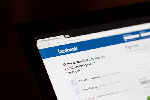 ISTANBUL, TURKEY - MARCH 16, 2013: Photo of Facebook.com home page on tablet. Facebook is the largest social media network and owned by Facebook, Inc.