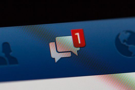 ISTANBUL, TURKEY - MARCH 16, 2013: Photo of Facebook notifications of friend messages on tablet.  Facebook is the largest social media network and owned by Facebook, Inc.