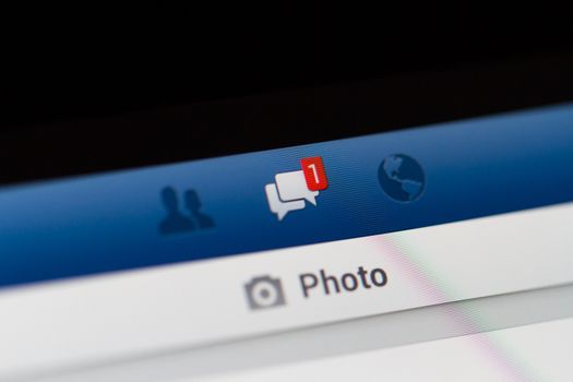 ISTANBUL, TURKEY - MARCH 16, 2013: Photo of Facebook notifications of messages on tablet.  Facebook is the largest social media network and owned by Facebook, Inc.