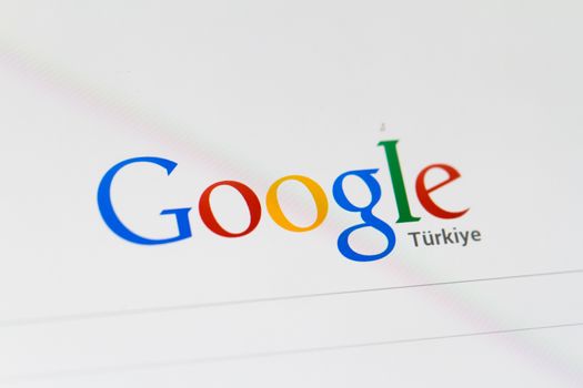 ISTANBUL, TURKEY - MARCH 16, 2013: Photo of Google.com search home page and logo on tablet.  Google is an American multinational corporation with different services and products.