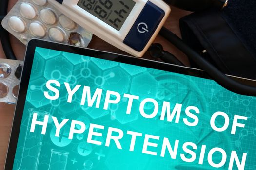 Tablet with the symptoms of hypertension and Electronic blood pressure monitor