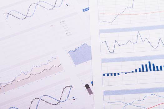 Business table with bar chart graphs.