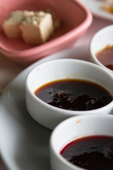 Breakfast service, jam in white bowl.