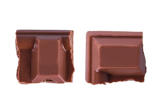 Top view of chocolate bar pieces, isolated on white background.