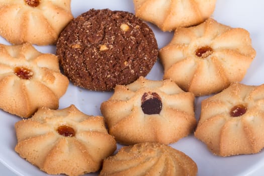 Heap of cookie chips on white.