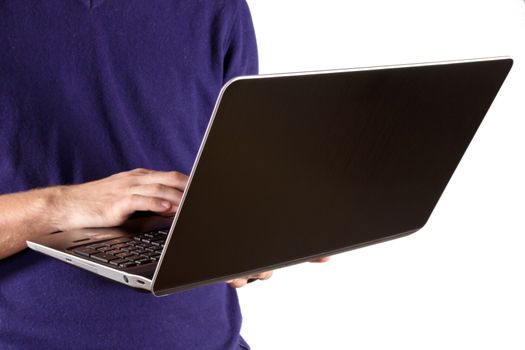 laptop with keyboard in mans hand