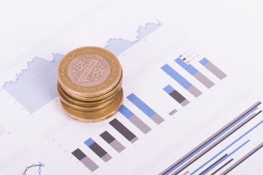 Financial chart with dollar banknotes and coins.