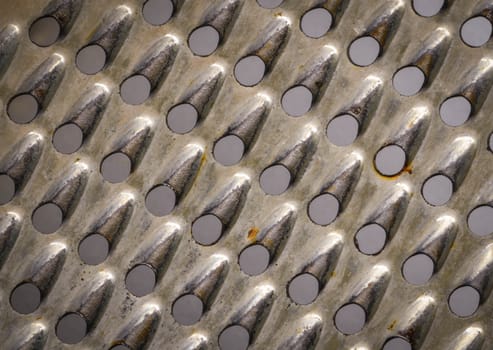 Abstract background of old perforated metal grater