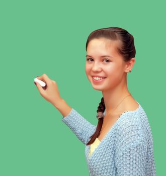 Girl schoolgirl meets an lesson on the background of the school boards. Isolated on a green background.