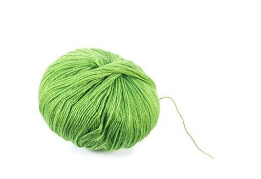 Green wool yarn ball isolated on a white background