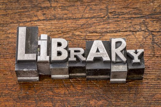 library  word in mixed vintage metal type printing blocks over grunge wood