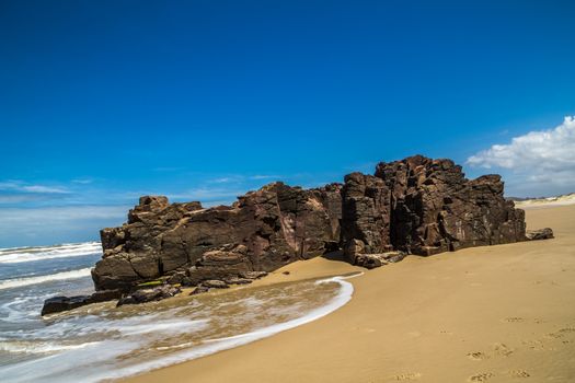 A beach rock with wave effect