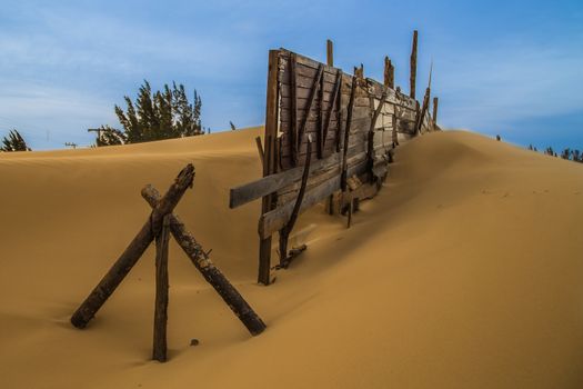 Fence of wood on the beach.