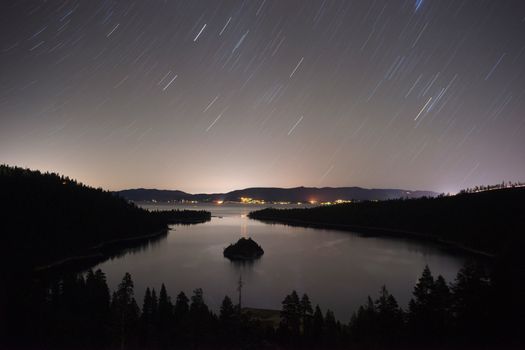 Stars make trails in the sky as the Earth rotates at night