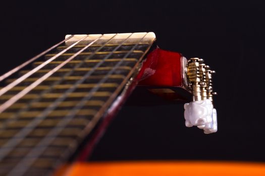 Detail view of fingerboard on classical guitar.