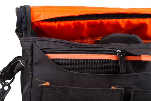 Close up view of open camera bag, isolated on white background.