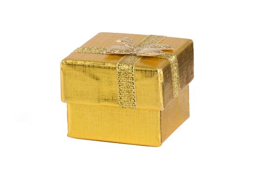 Closed, golder colored, empty gift box, isolated on white background.