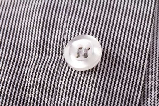 Close up view of shirt button.