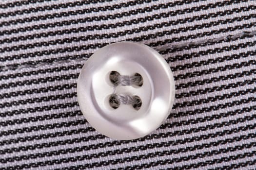 Close up view of shirt button.