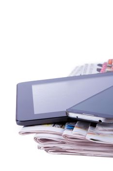 Stack of newspapers, tablet and mobile phone with blank screen, isolated on white background.