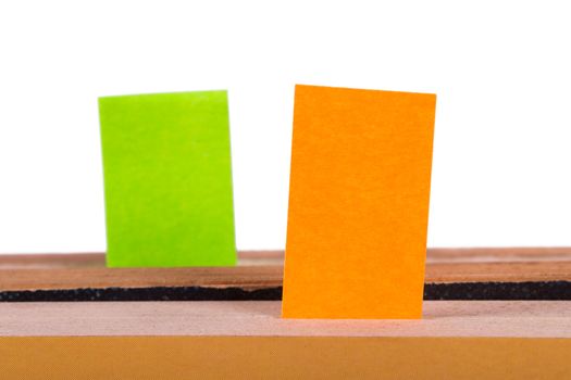 Post it marker inside books, isolated on white background.